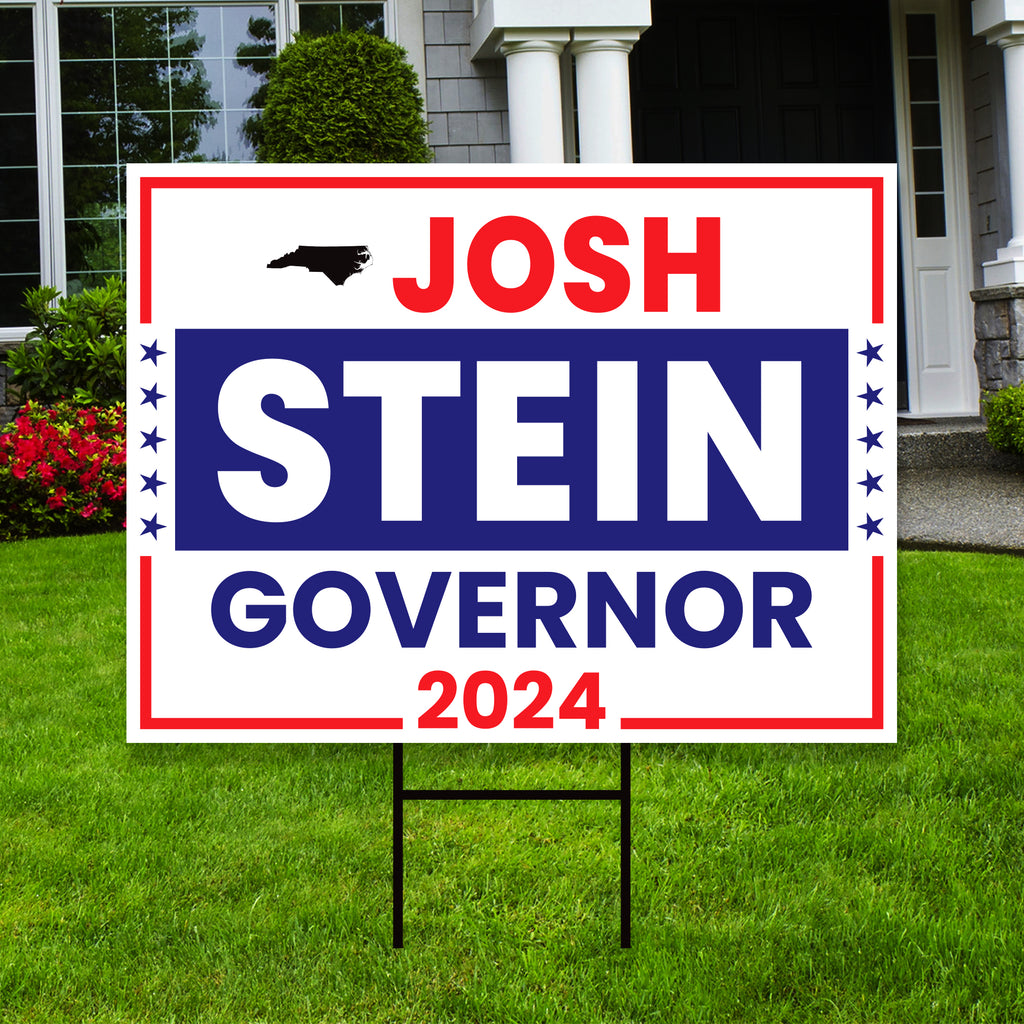 a political yard sign in front of a house