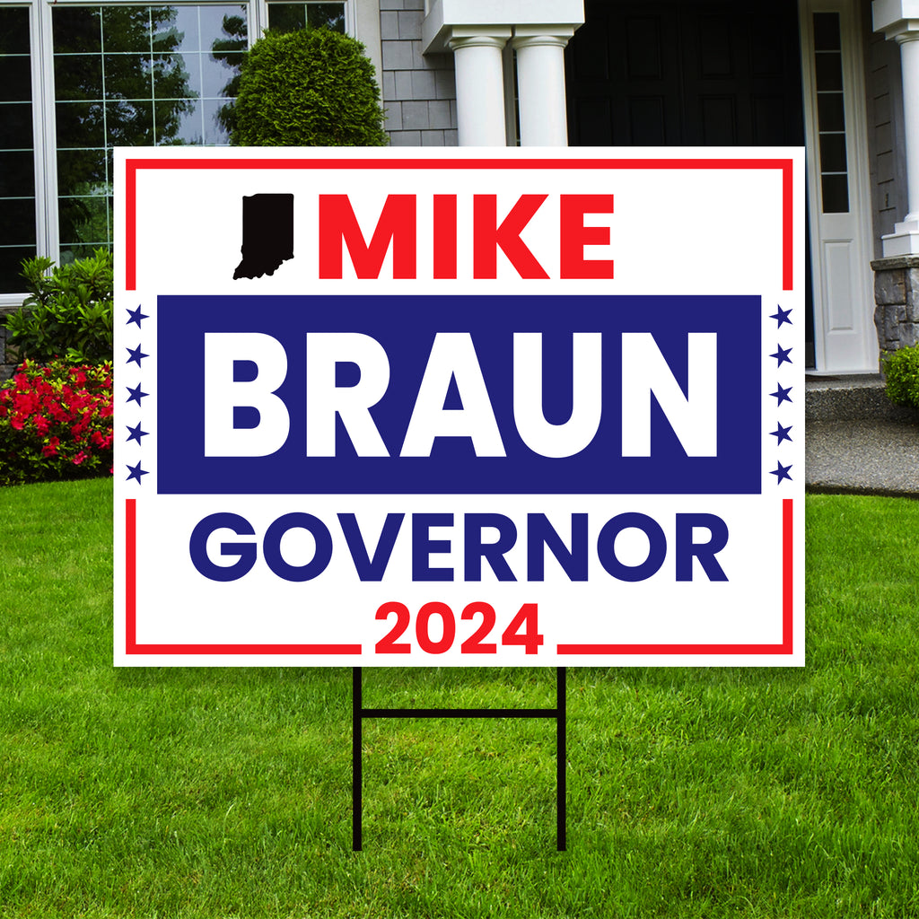 a political yard sign in front of a house