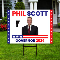 a political yard sign in front of a house