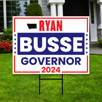 a political yard sign in front of a house