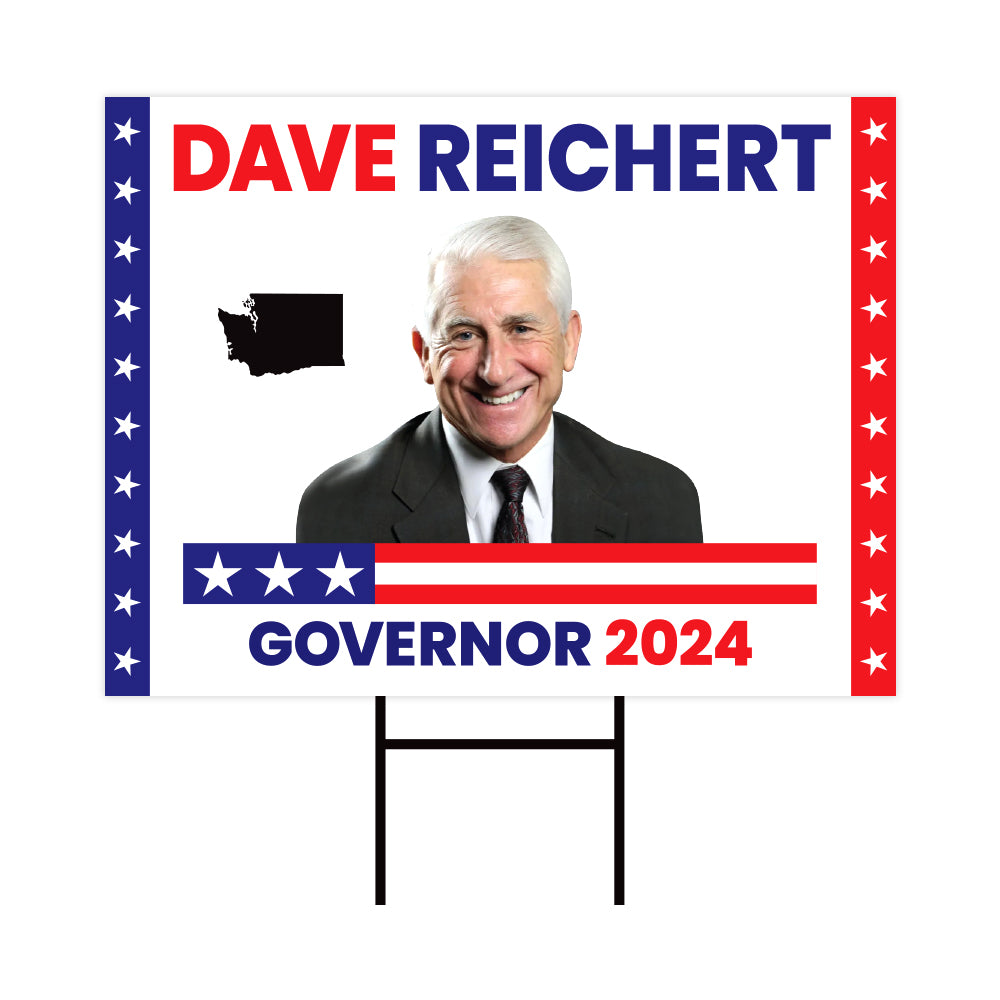 a political sign with a picture of a man in a suit and tie