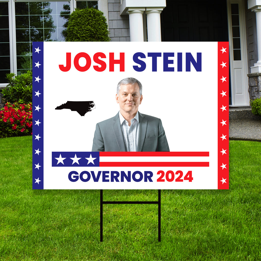 a political yard sign in front of a house