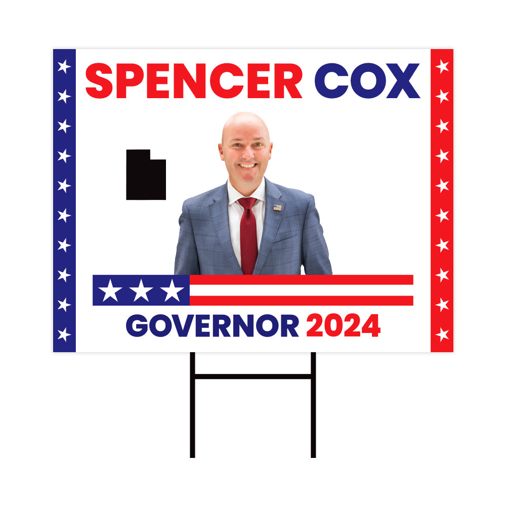 a political sign with a picture of a man in a suit and tie