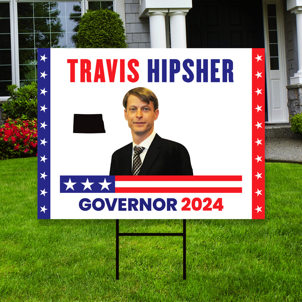 a political yard sign with a picture of a man in a suit