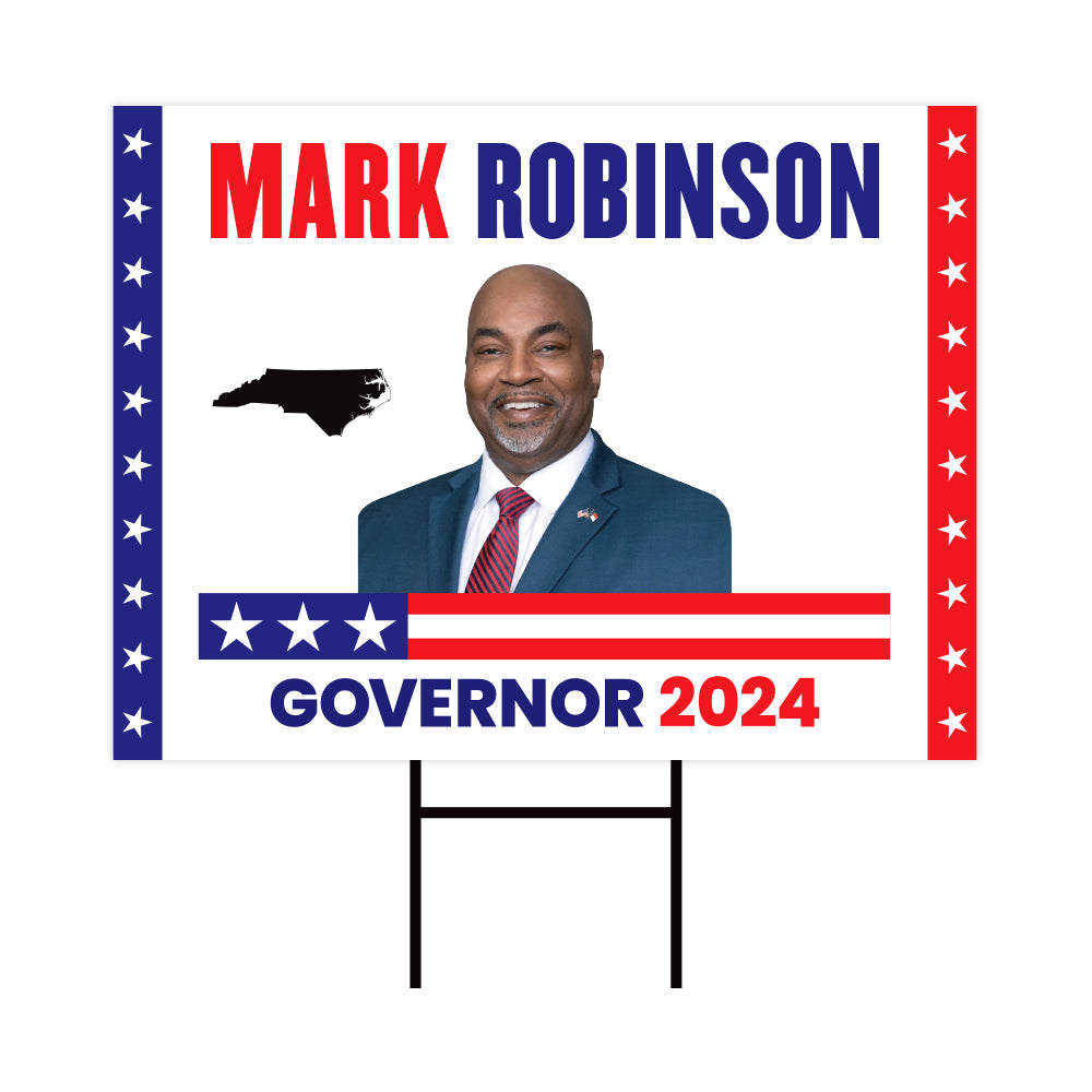 a political sign with a picture of a man in a suit