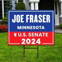 a real estate for sale sign in front of a house